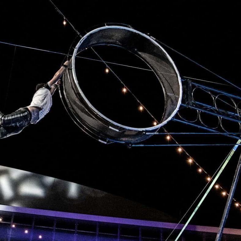 An acrobat performing in the air at the circus show near Travelodge Hotel & Convention Center Québec City