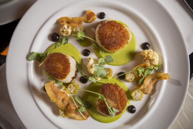 Close-up of Scallop dish served at The Diplomat Resort