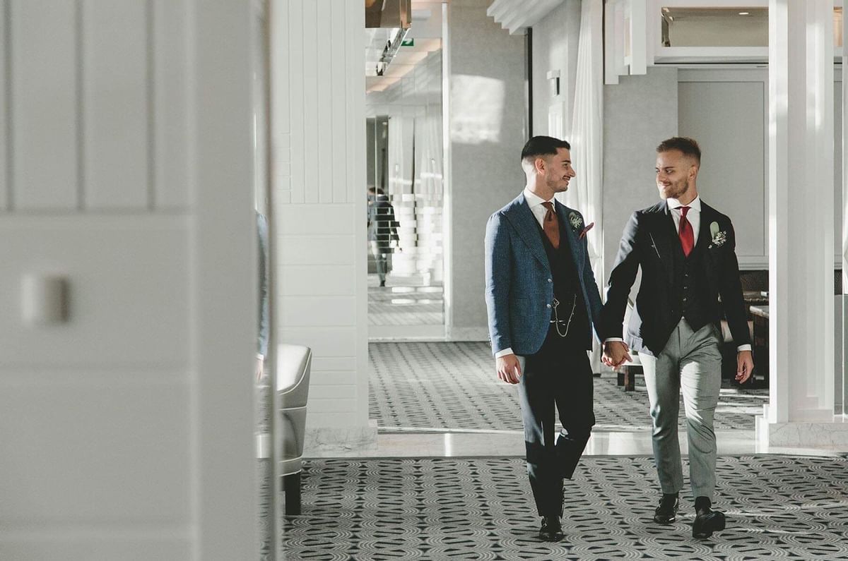 Two men walking on the hallway at Crown Hotel Perth