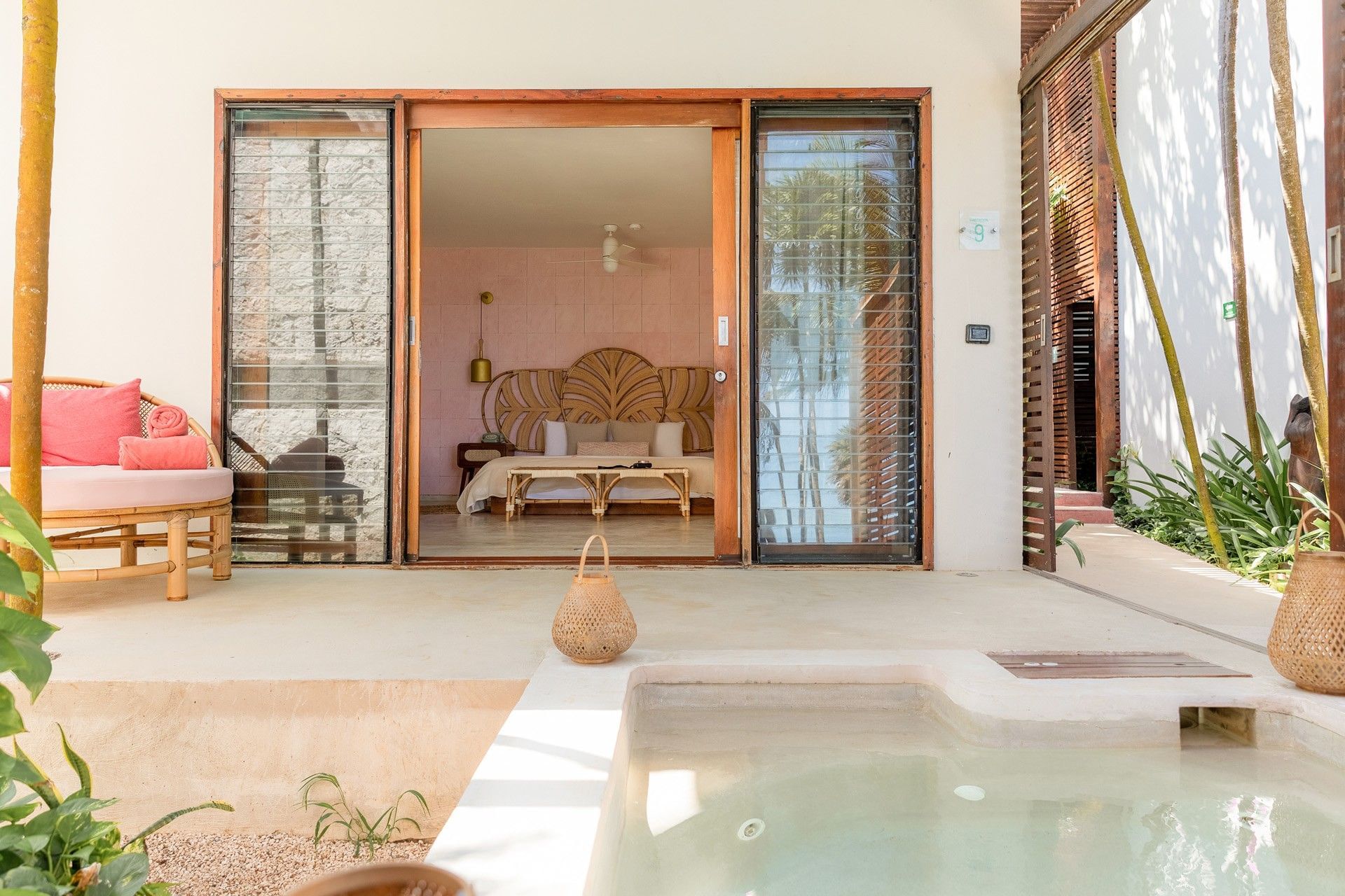 Private plunge pool and room terrace surrounded by palms at Mi Amor