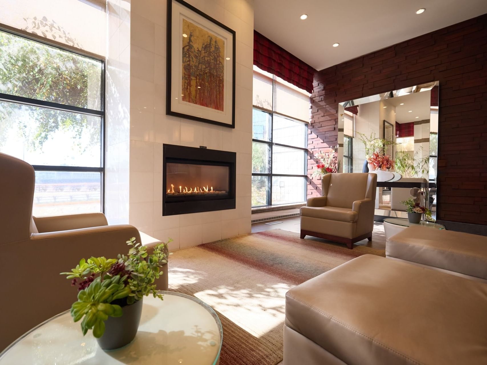 Fireplace with comfy sofas in the lobby at Ruby Foo's Hotel