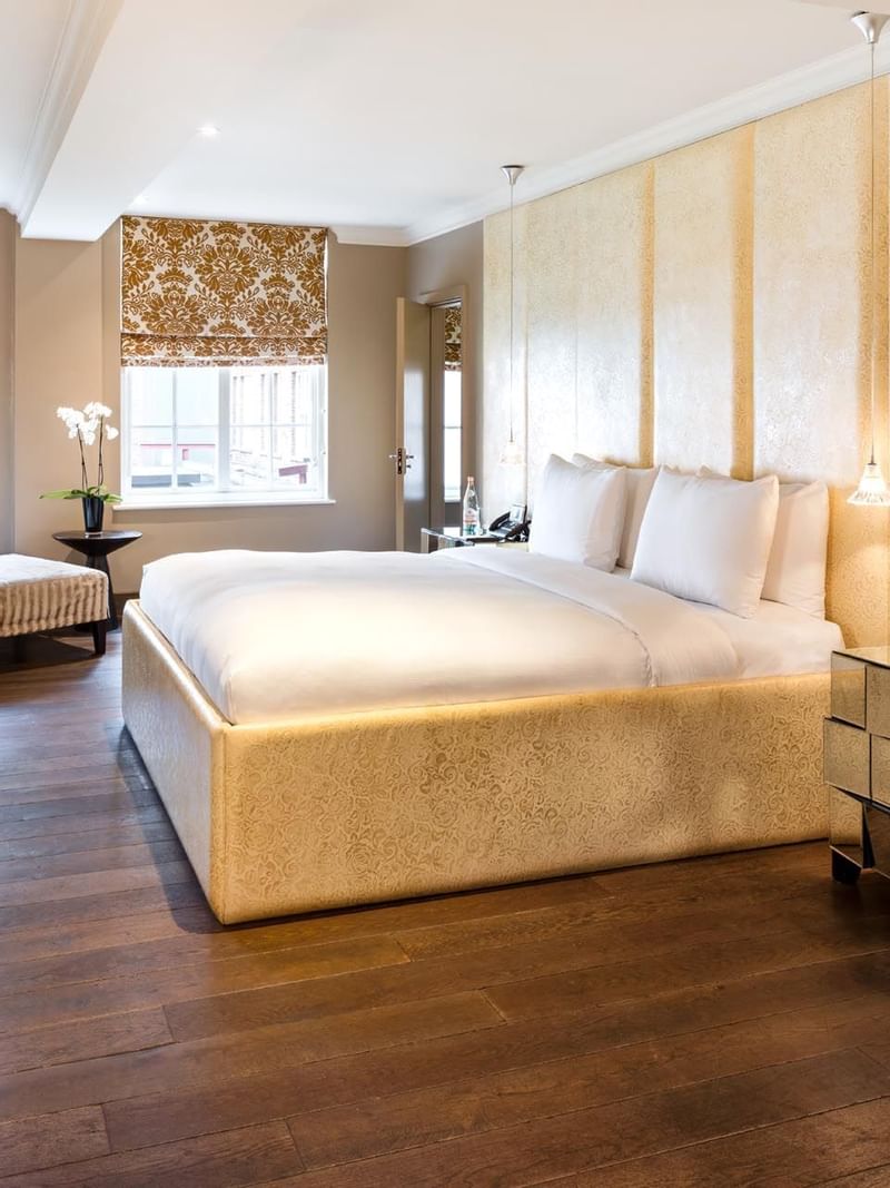 Interior of a room with king bed at The May Fair Hotel London