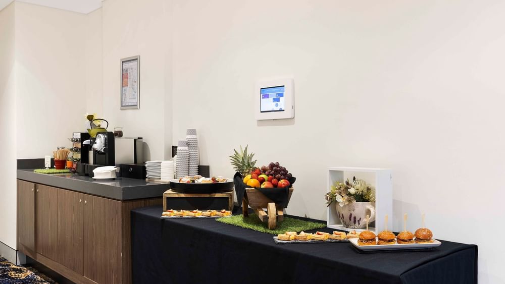 Refreshment station with a variety of fruits and finger foods in The Hastings Boardroom at Novotel Sydney on Darling Harbour