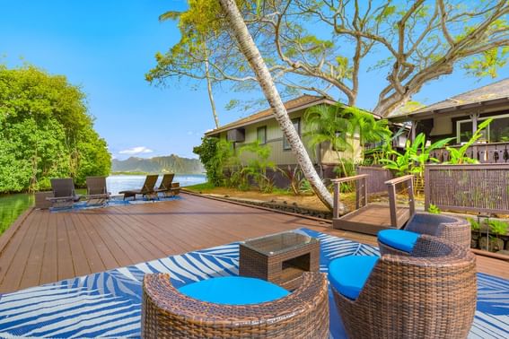 Lounge area by the private cottage deck at Paradise Bay Resort