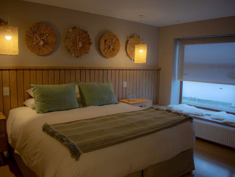 Bedroom of NOI Suite with a kingbed at NOI Indigo Patagonia