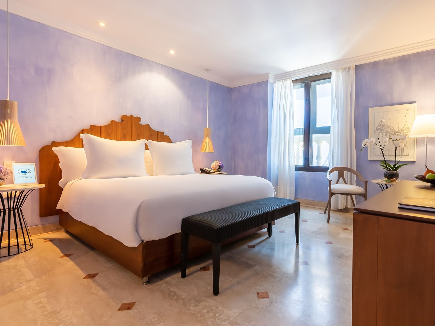 Elegant Classic bedroom with courtyard view of the Charleston Santa Teresa Hotel in Cartagena.