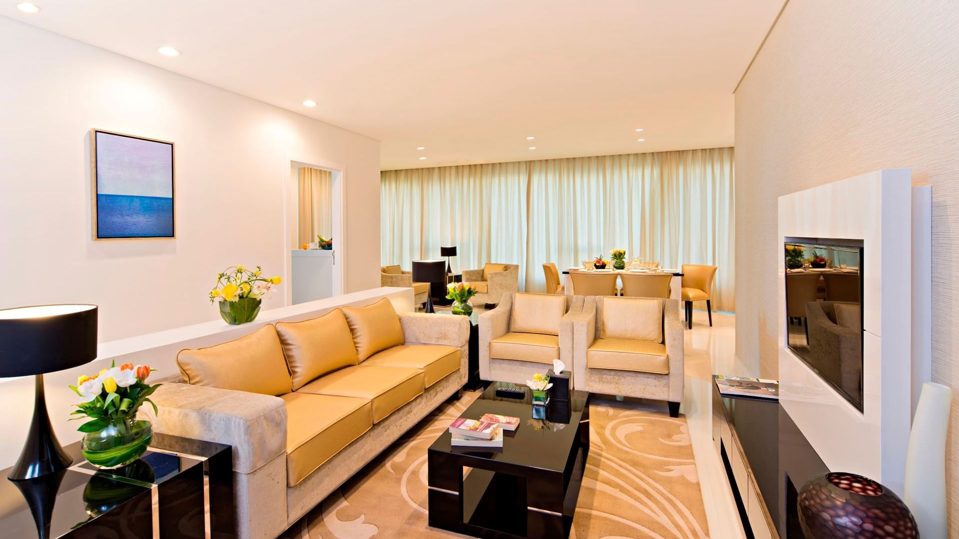 Fully equipped living room with luxury sofa set in Three Bedroom Suite at DAMAC Maison Canal Views