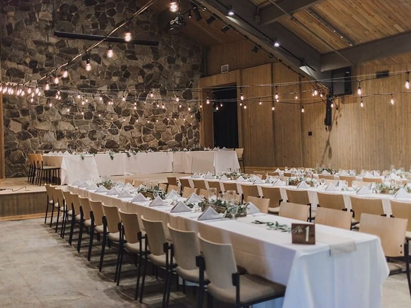 Dining tables are arranged in Chapel Theater at Sleeping Lady 