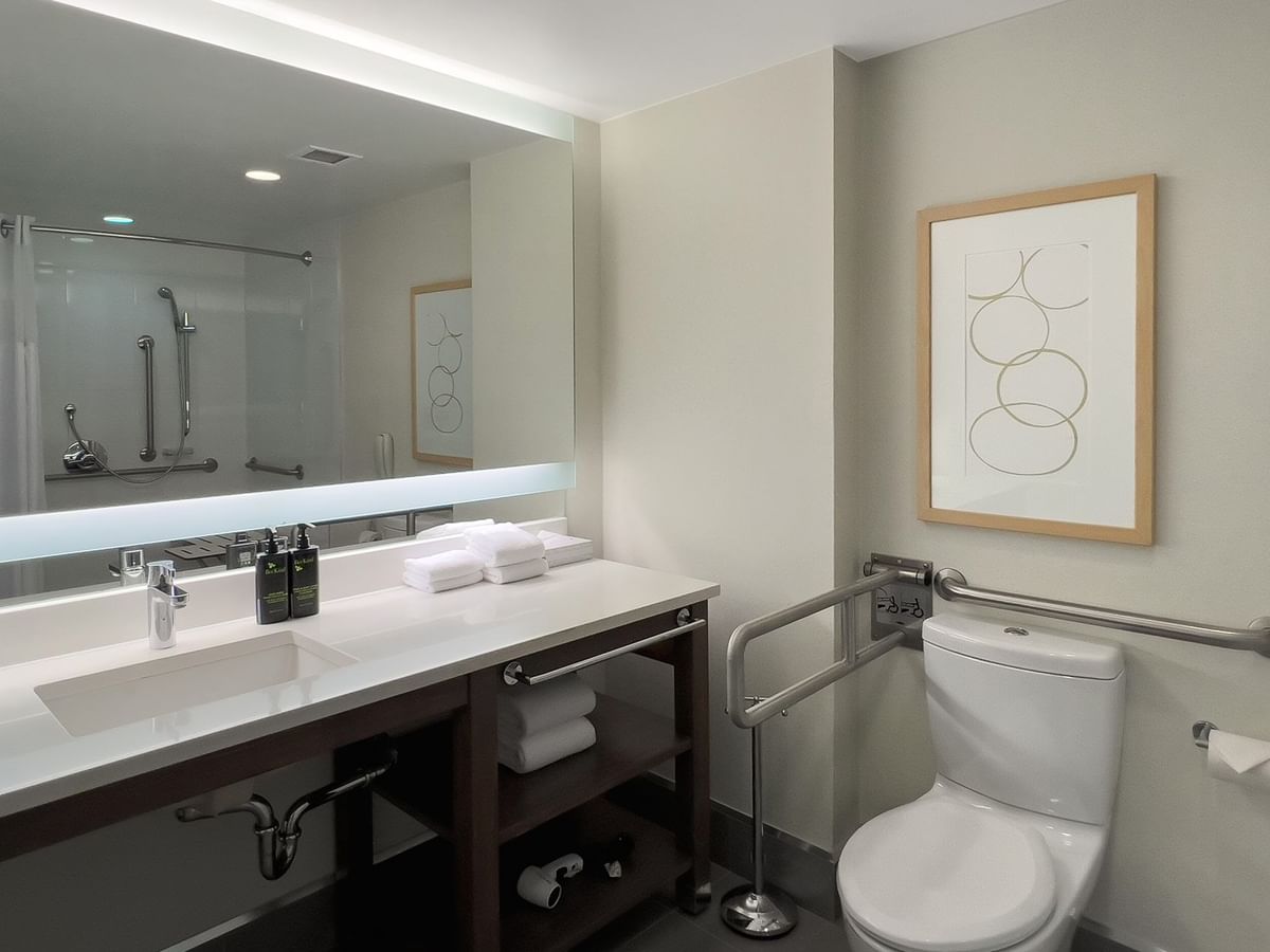 Accessible hotel guestroom bathroom with grab bars