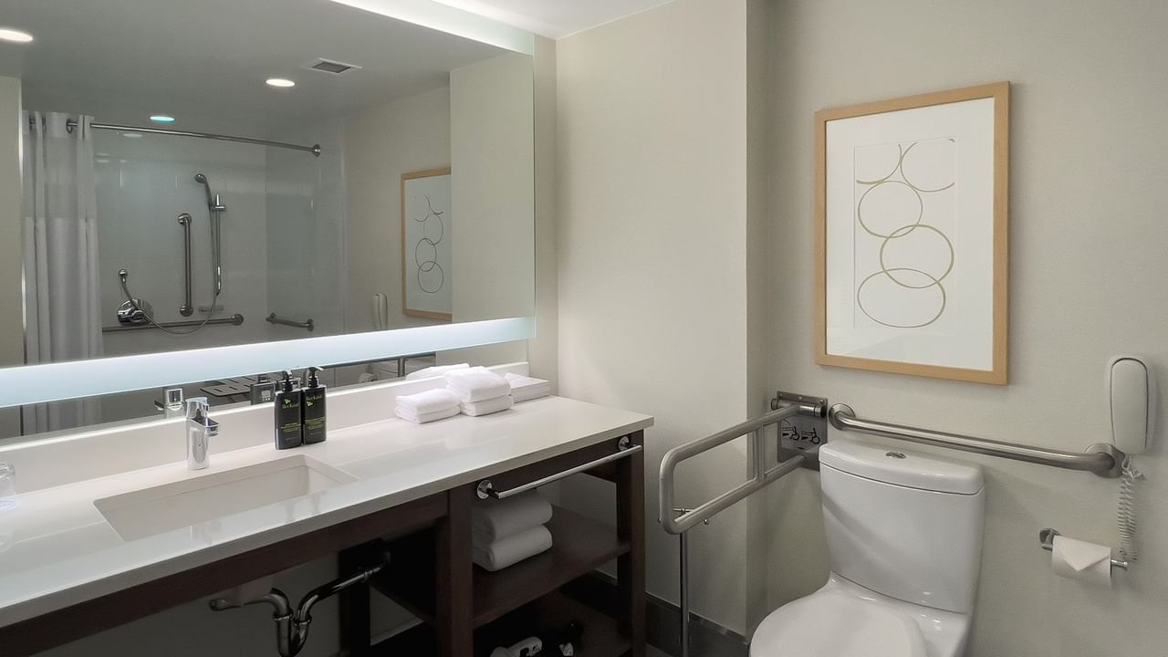 Accessible hotel guestroom bathroom with grab bars