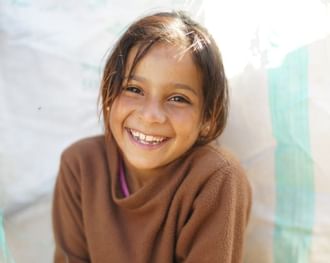A small girl smiling at Palazzo Versace Dubai