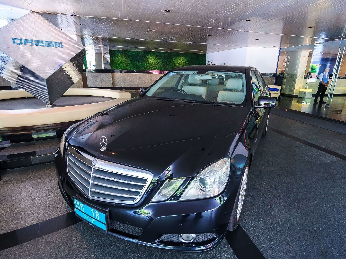Black Mercedes- Benz car in on suite parking at Dream Hotel 