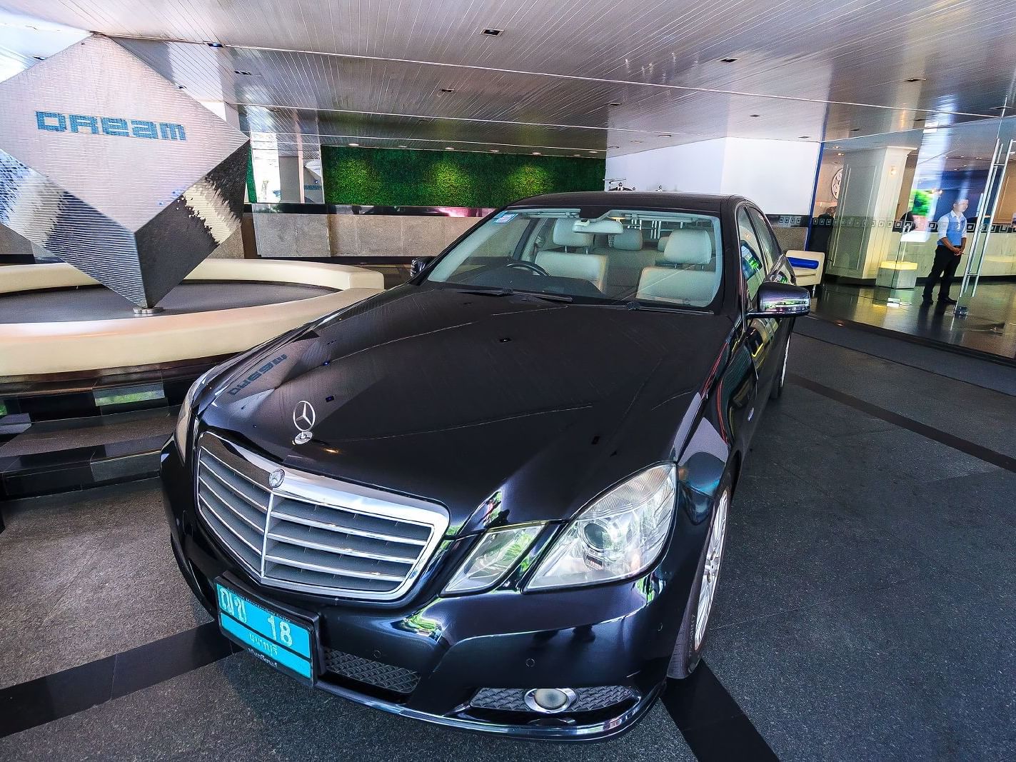 Black Mercedes- Benz car in on suite parking at Dream Hotel