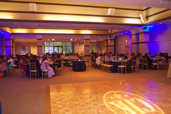 A wedding ceremony in a ballroom at Kellogg Conference Center 