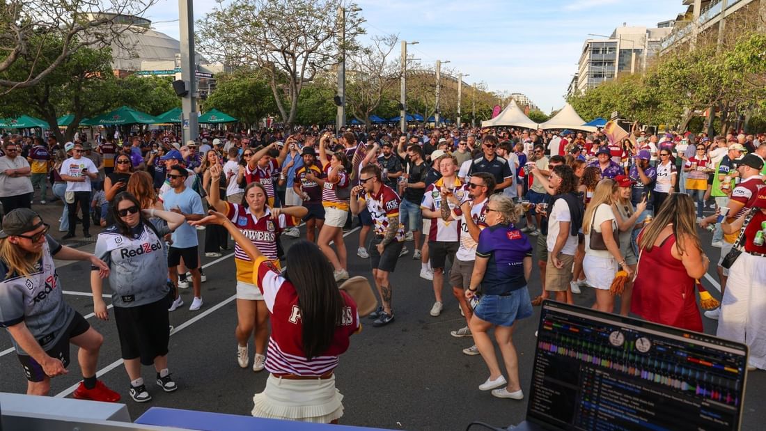DJ performing live music for a dancing crowd outdoors at The Brewery Bar + Kitchen at Novotel Sydney Olympic Park