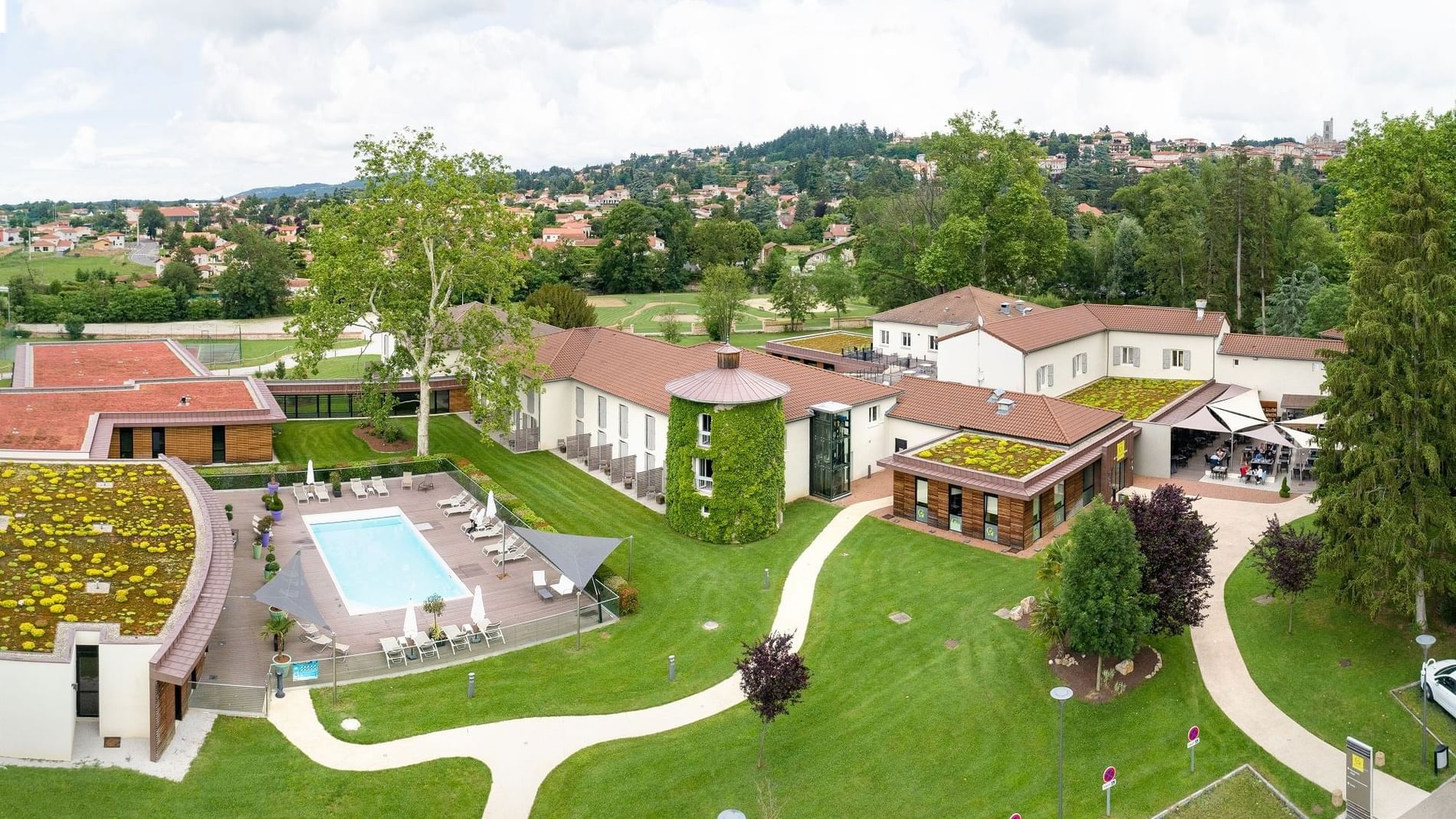 Pool with the seating area at Domaine de la Charpiniere Hotel