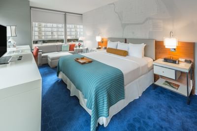 King bed in Deluxe City View King Room at Kinzie Hotel