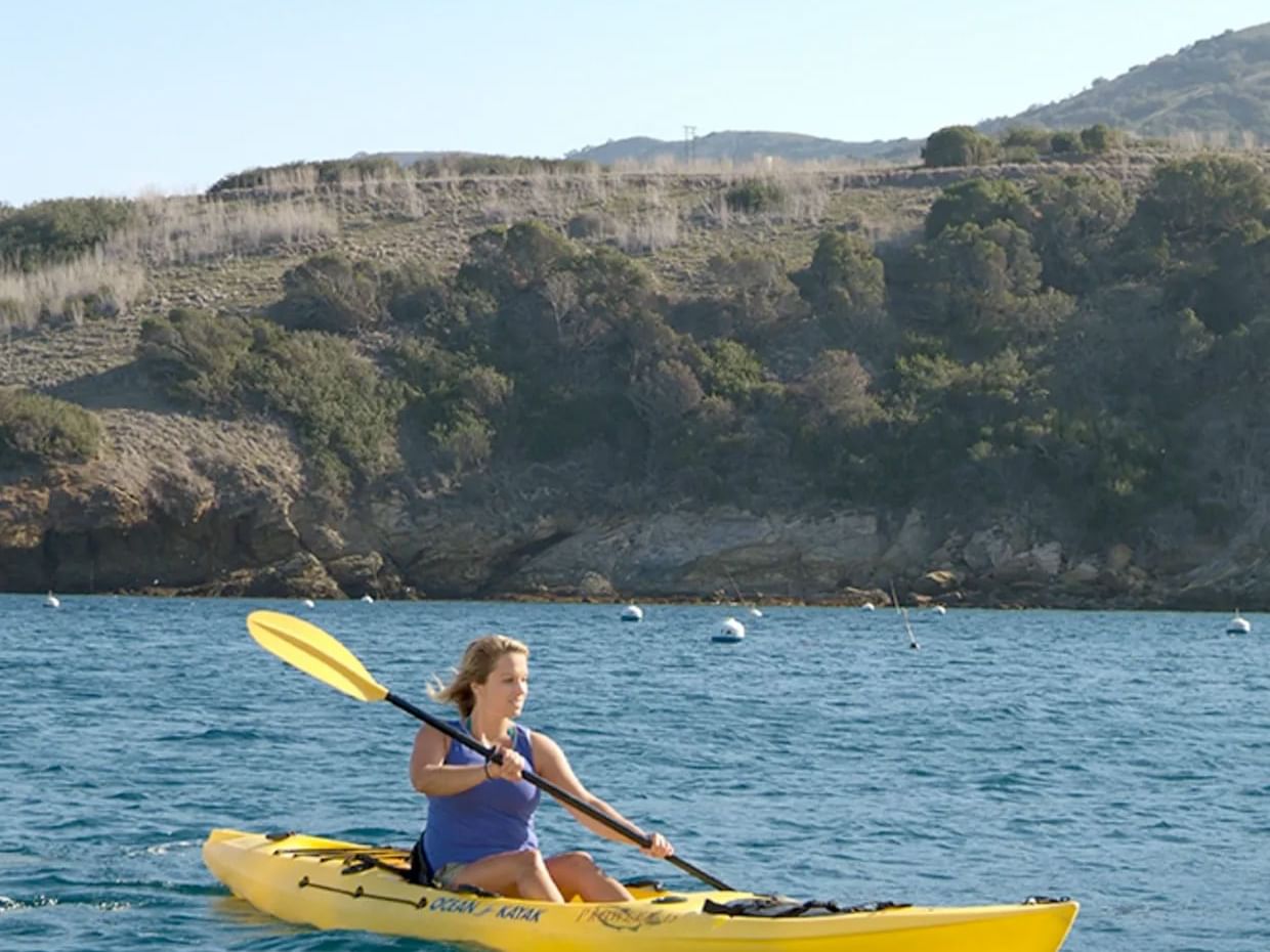 A lady kayaking on sea near Catalina Island Company, one of the things to do in catalina island