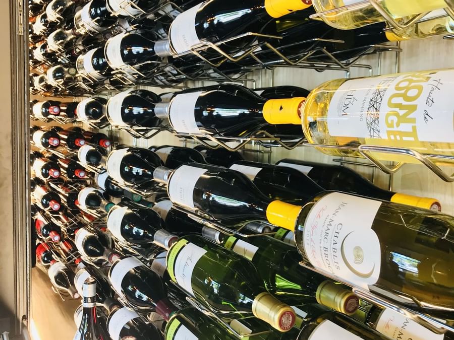 Wine bottles on a shelf at Grand Hotel Saint-Pierre
