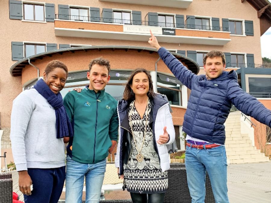 Friends posing by the entrance at The Originals Hotels