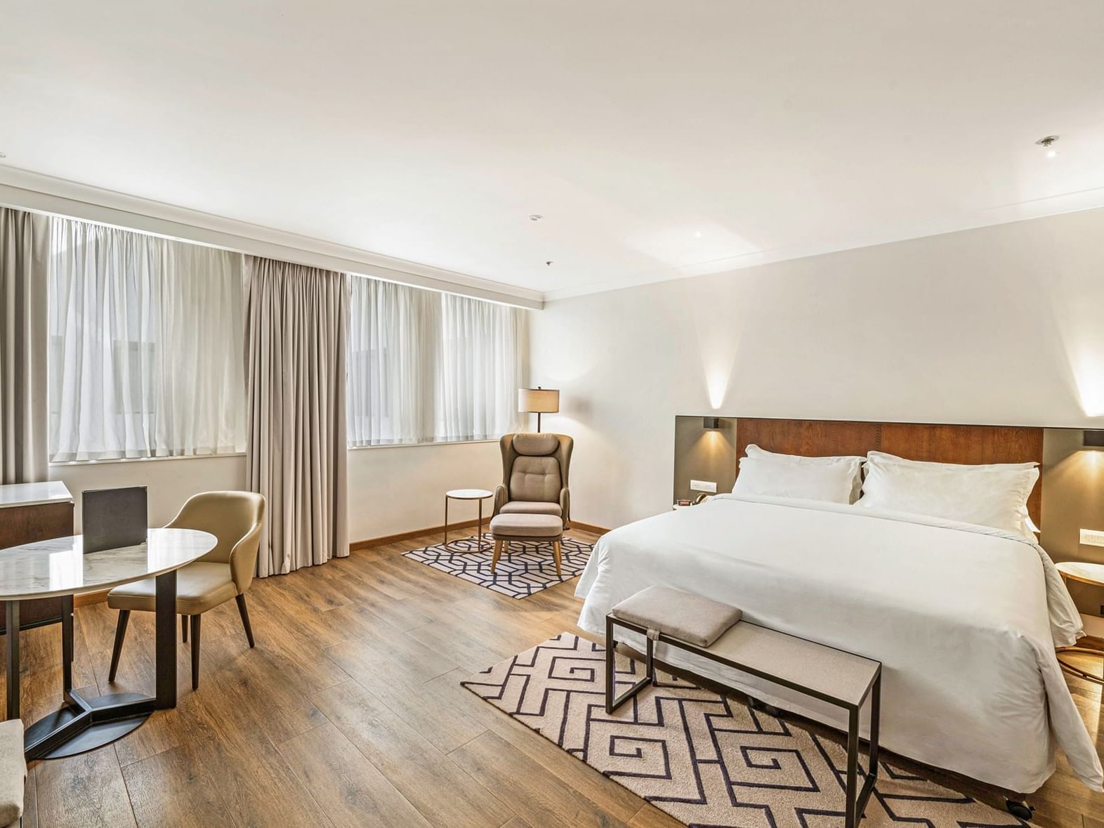 King bed and lounge in Signature Premium at The Grace Sydney