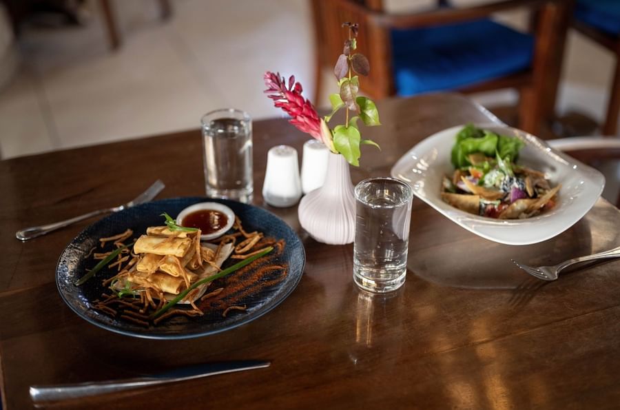 Crispy spring rolls served with sauce and fresh salad bowl in Lagoon Terrace Restaurant at warwick le lagon-vanuatu