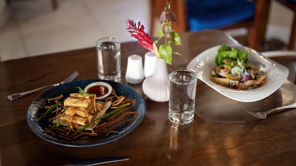 Crispy spring rolls served with sauce and fresh salad bowl in Lagoon Terrace Restaurant at warwick le lagon-vanuatu