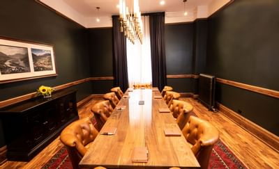 Table and chairs in the 1893 Boardroom at the Hotel Colorado