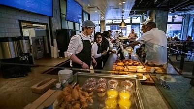 Customers buying coffee from The Baristas at The Godfrey Hotel