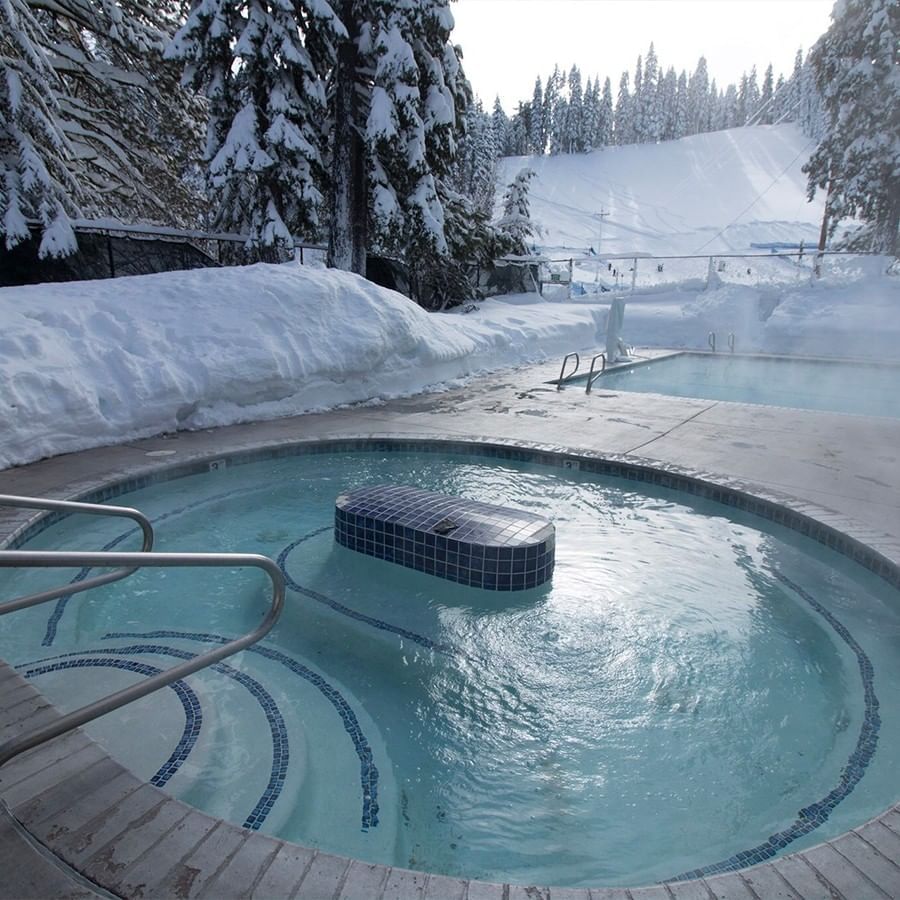 Outdoor hot tub in winter at Granlibakken Tahoe