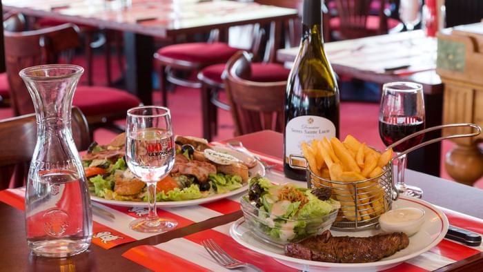 Closeup of Meals served with wine at Hotel L'Acropole