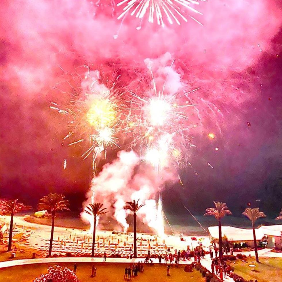 Fireworks in the night sky near Falkensteiner Resort Capo Boi