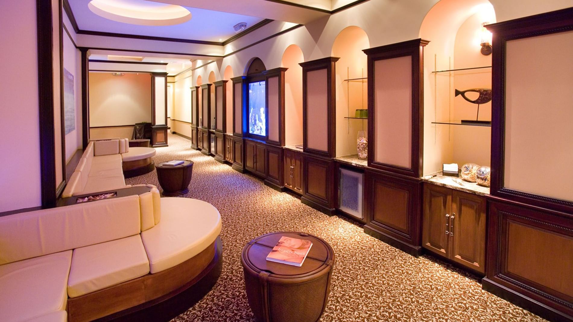 Reflections Spa & Salon interior with curved sofas at Lake Buena Vista Resort Village & Spa