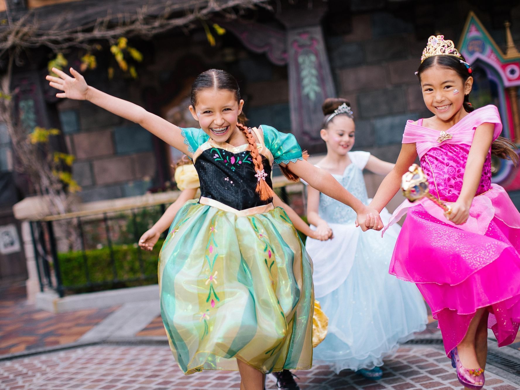 Kids running at Disney dressed as princesses