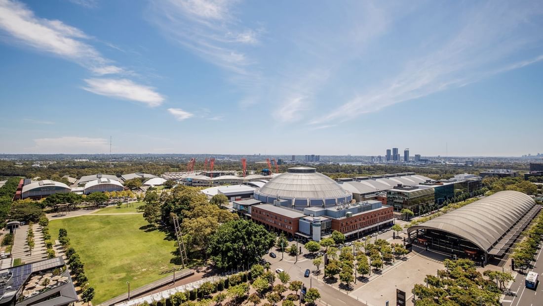 Distant view of the Sydney Showground on a sunny day near Pullman Sydney Olympic Park