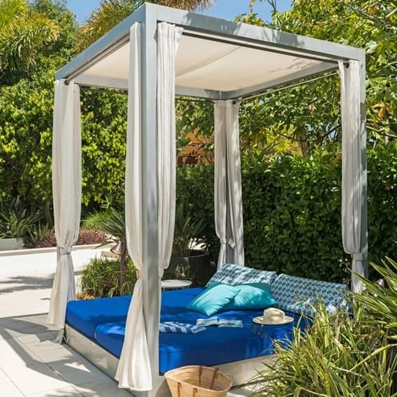 Hat & pillows on a luxury sunbed at Crown Metropol Perth