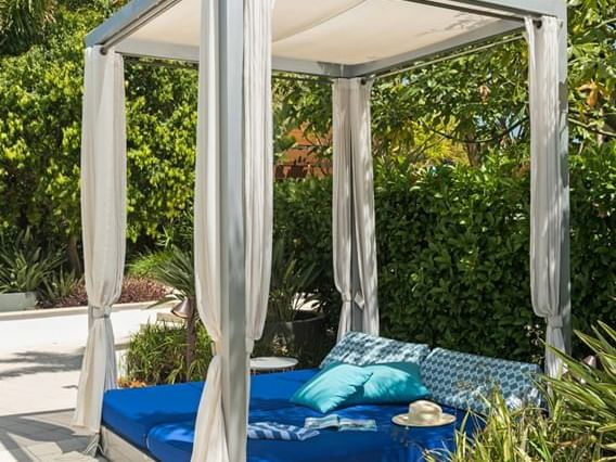 Hat & pillows on a luxury sunbed at Crown Metropol Perth