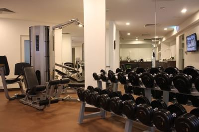 Dumbbells & other equipment in a Gym at Goodwood Park Hotel