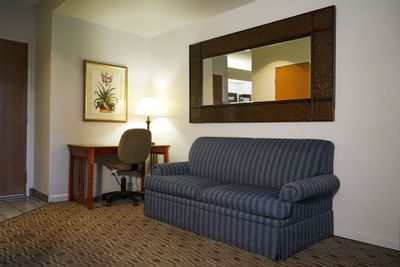 Working desk next to the sofa in 1King Bed Suite at Buena Vista