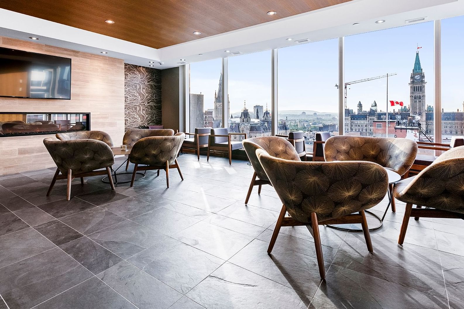 Lounge area with a city view from the window at ReStays Ottawa