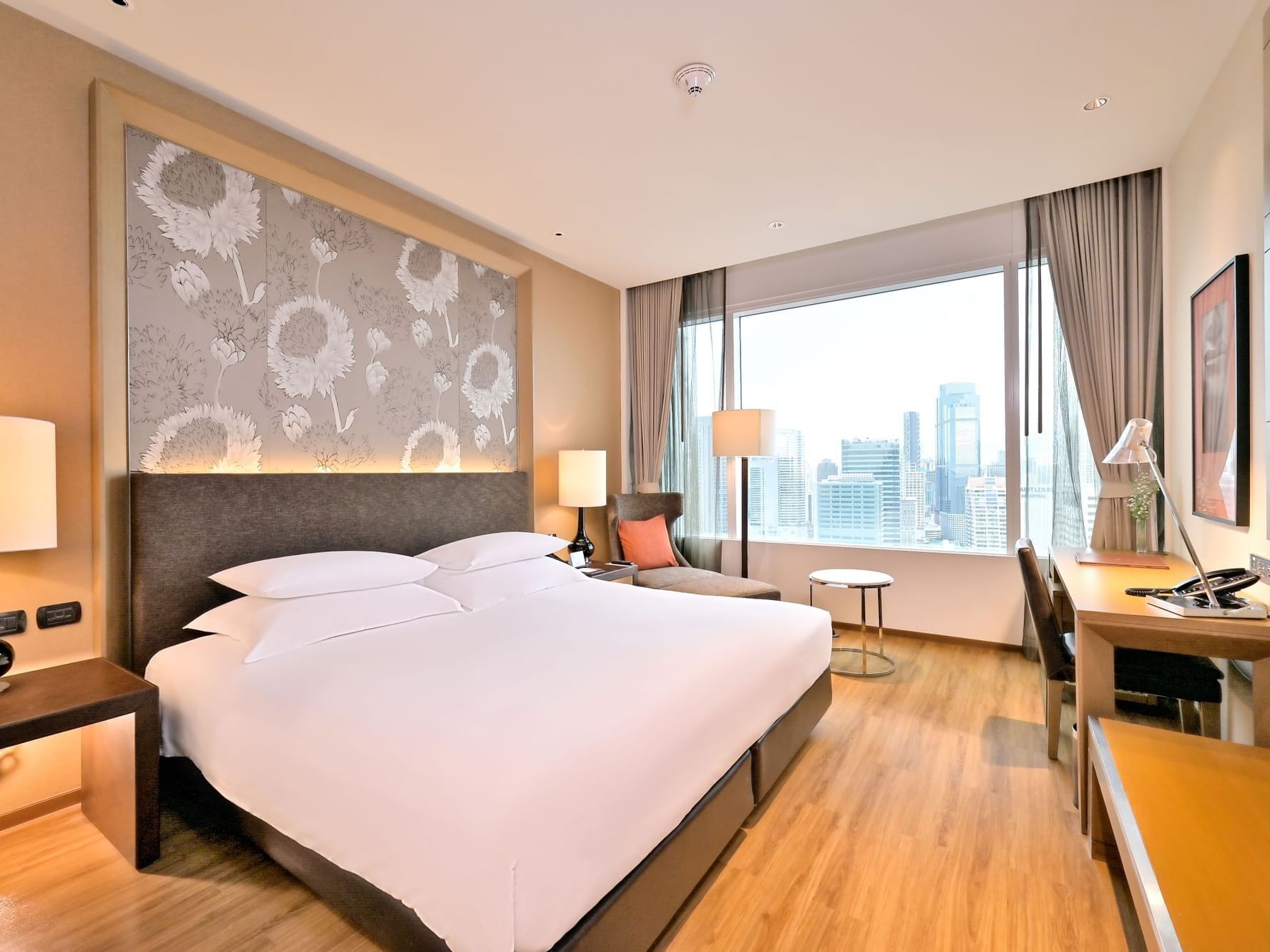 Bed, working area with TV in Superior Sky Room at Eastin Grand Hotel Sathorn