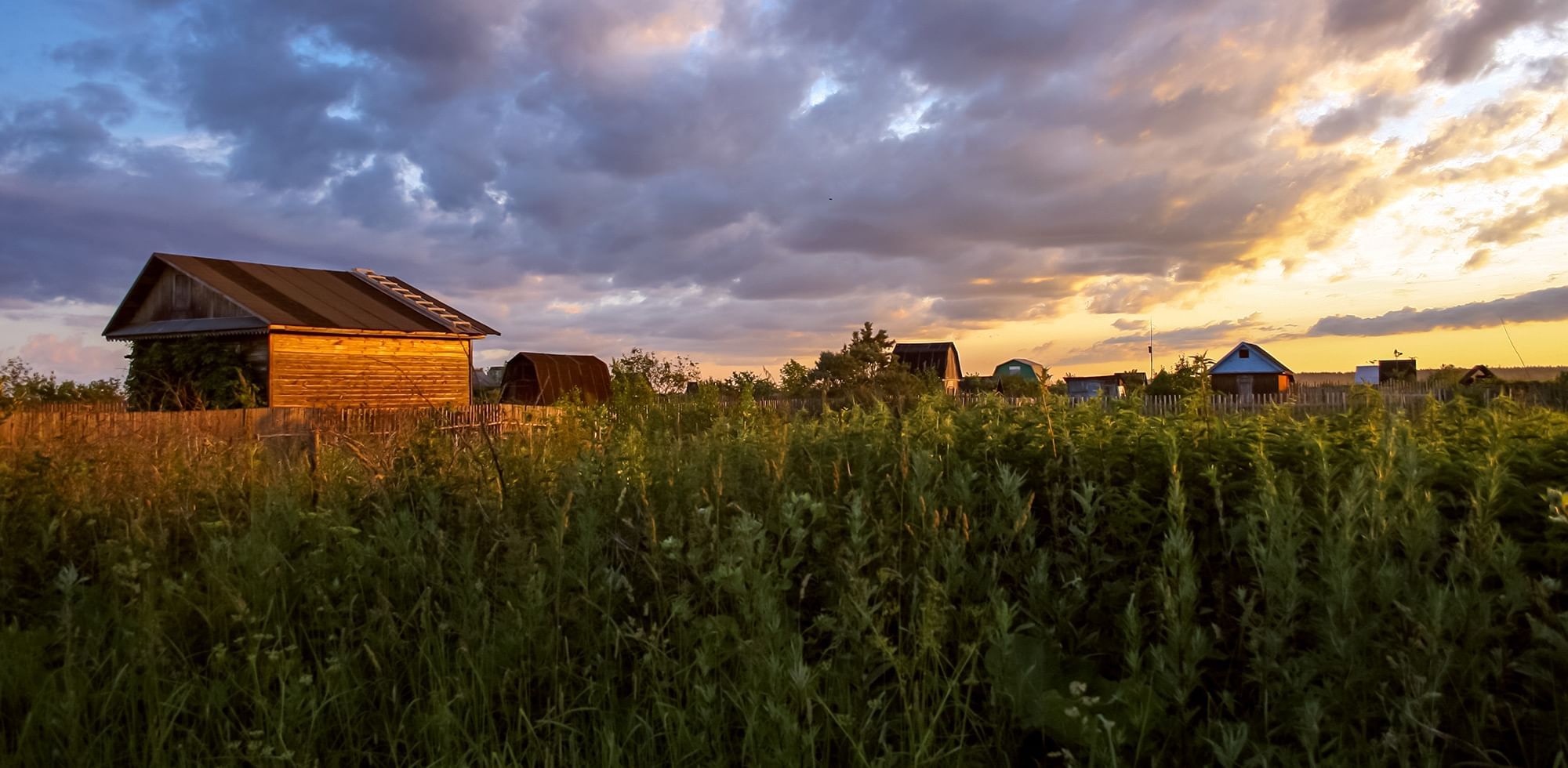 prairie village landscape at sunset