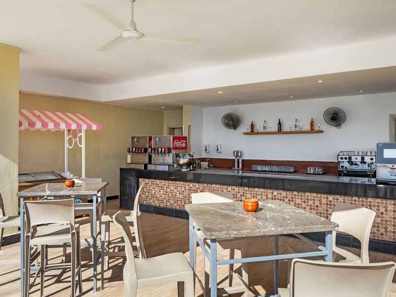 Cozy Beach Snack Bar with tables and chairs at Pickalbatros Dana Beach Resort in Hurghada.