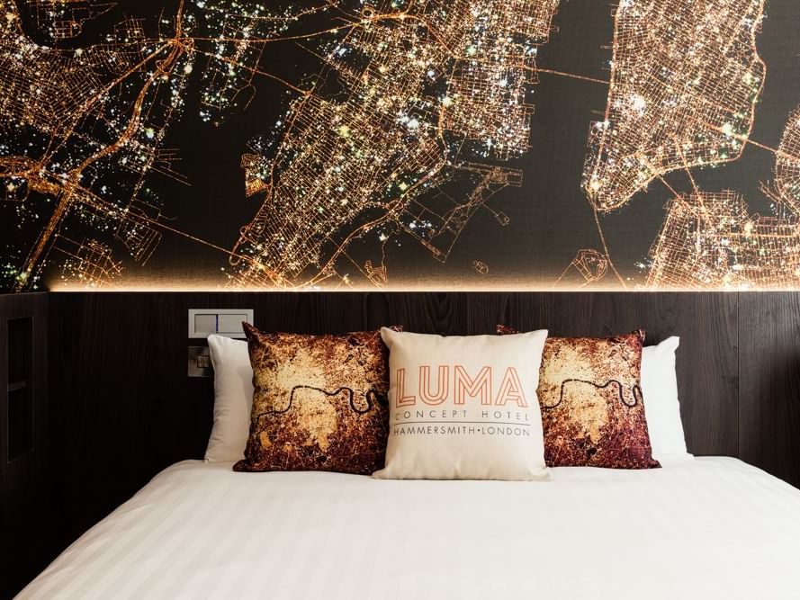 Closeup on a bed in a hotel room at Heeton Concept Hotels