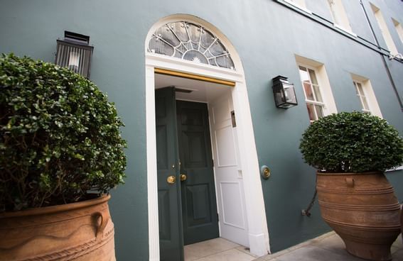 Entrance door with two potted trees at Gorse Hill