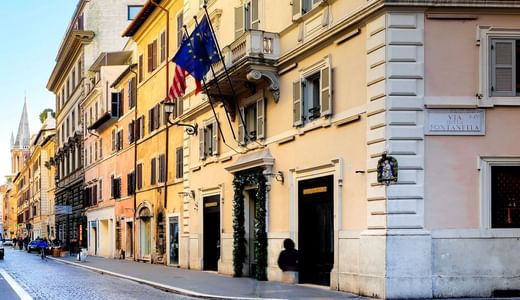 Exterior view of Babuino 181 Luxury Suites with road near Rome Luxury Suites