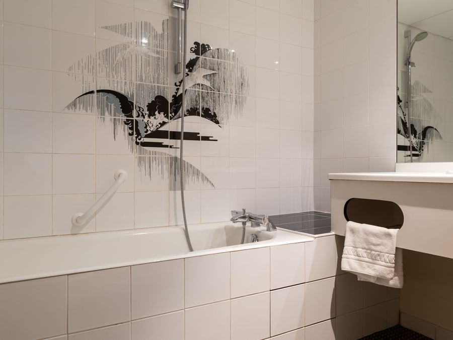 Bathtub & vanity in the bathroom at  Hotel Le Pariou