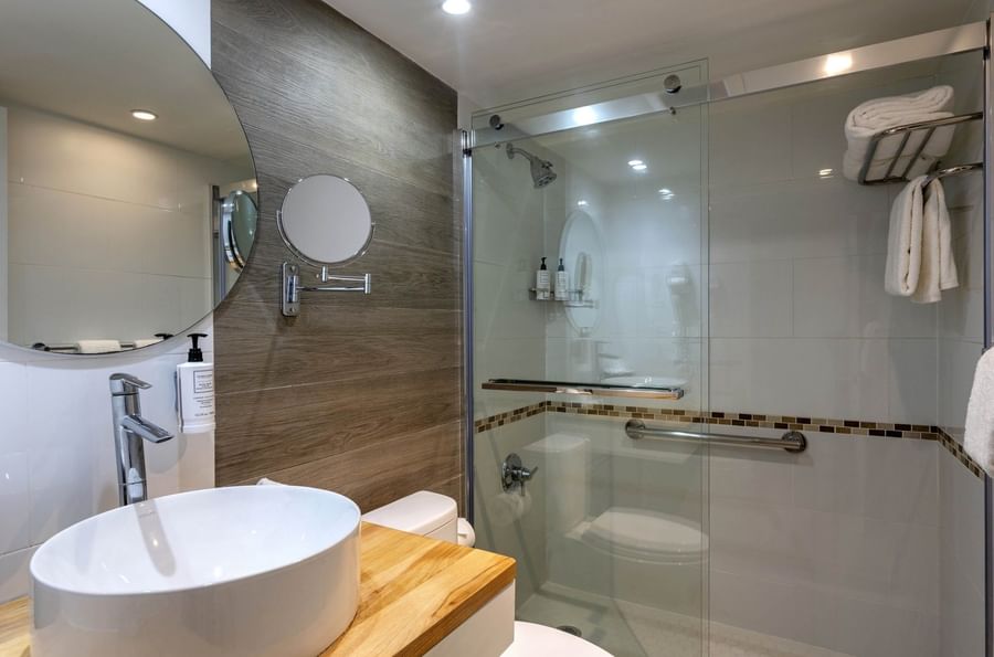 Modern bathroom with a vessel sink and a glass shower in Harbour Premium Balcony at Warwick Paradise Island Bahamas