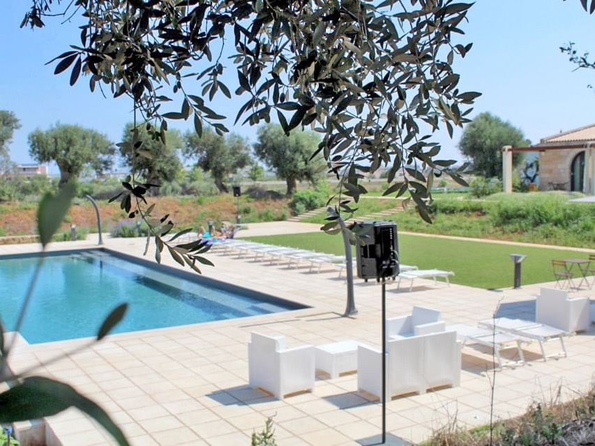 Outdoor pool area with the lounge at Masseria Stali