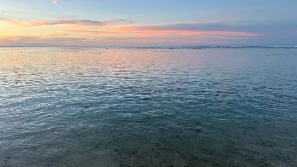 Sunset over clear waters at Tambua Sands Beach Resort in Sigatoka.
